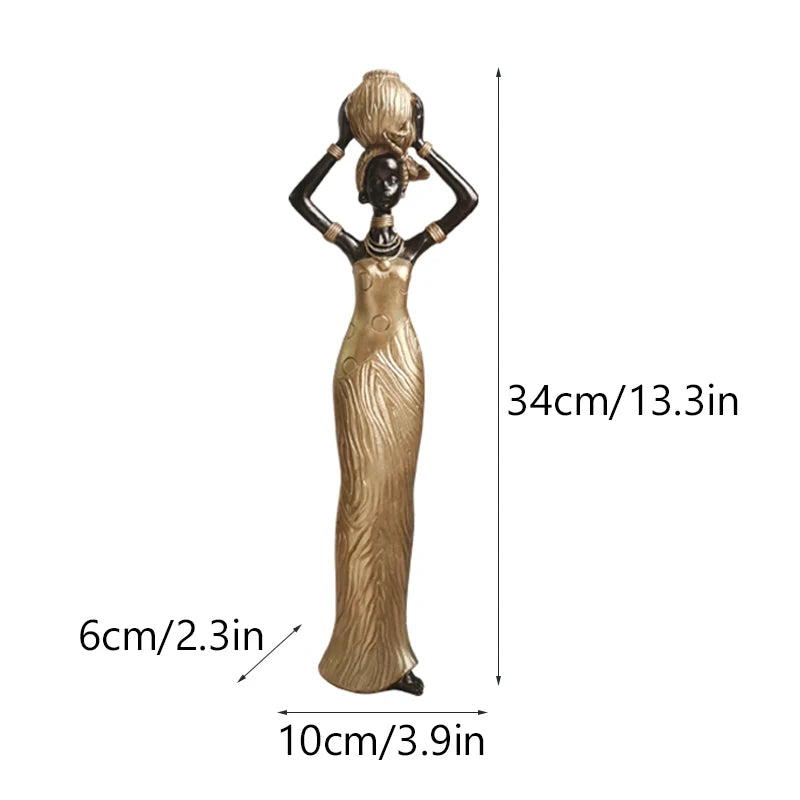 African resin woman statue in textured gold dress, 34cm tall, carrying pot overhead with 10cm base