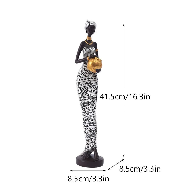 African resin woman statue in black and white tribal dress, 41.5cm tall, holding gold pot with 8.5cm base