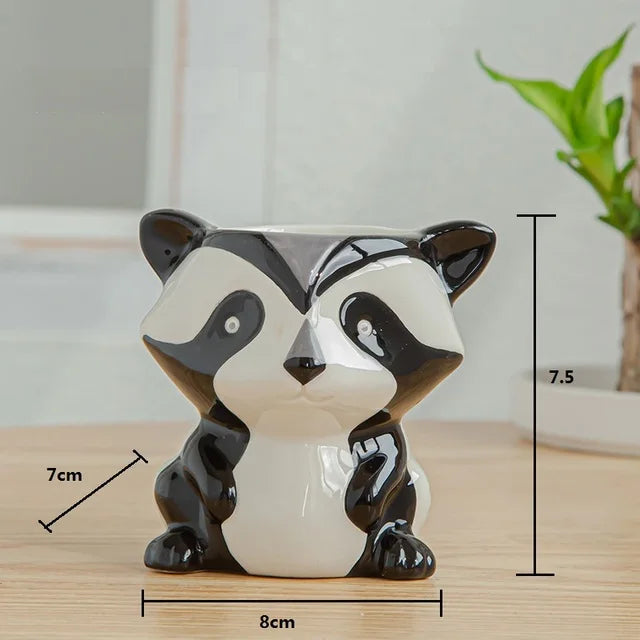 Ceramic animal planters shaped like a  raccoon for a succulent plant or cacti 

