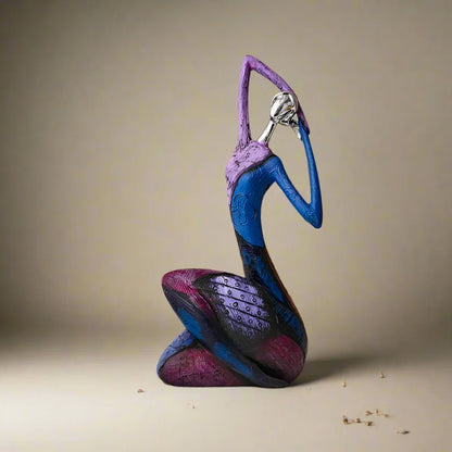 Kneeling abstract resin sculpture in purple and blue tones with metallic silver head, modern art decor figure
