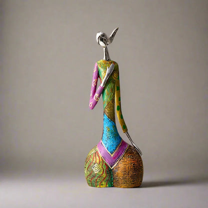 Colorful standing abstract resin sculpture with metallic head, geometric patterns and textured design for modern home decor